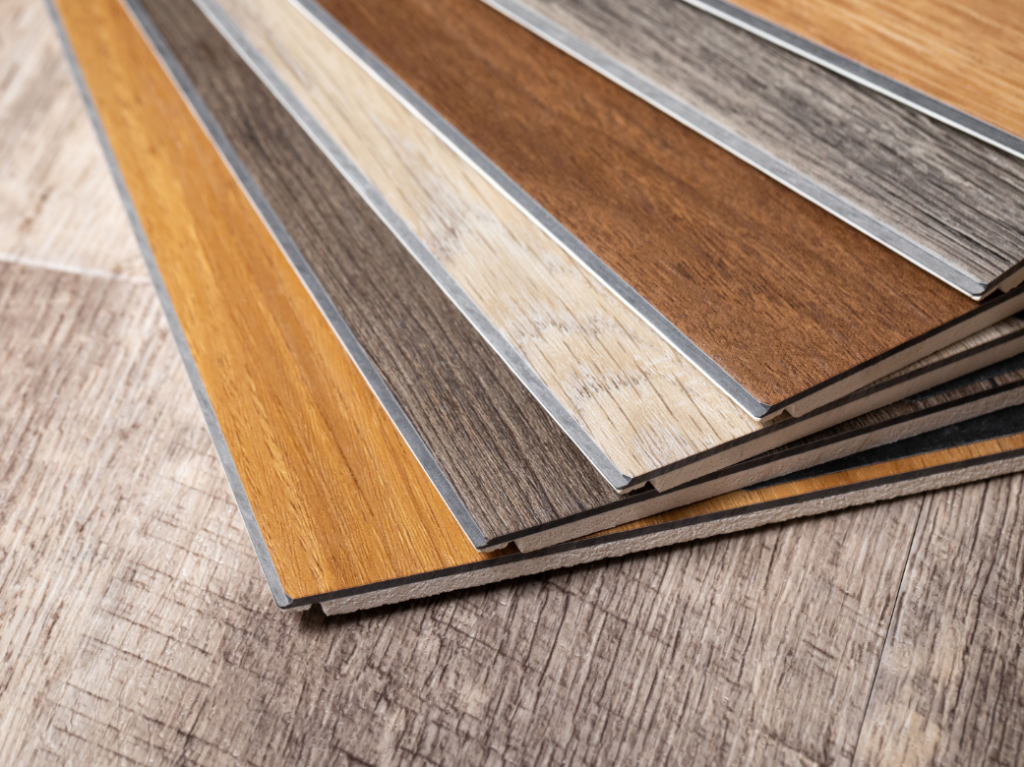 Olive-toned realistic wood-look SPC rigid-core luxury vinyl plank flooring, highlighting waterproof durability as a leading 2026 trend in Florida homes